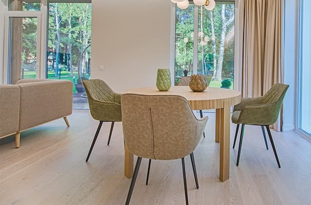 Dining room with chairs pushed in around a neat clean table